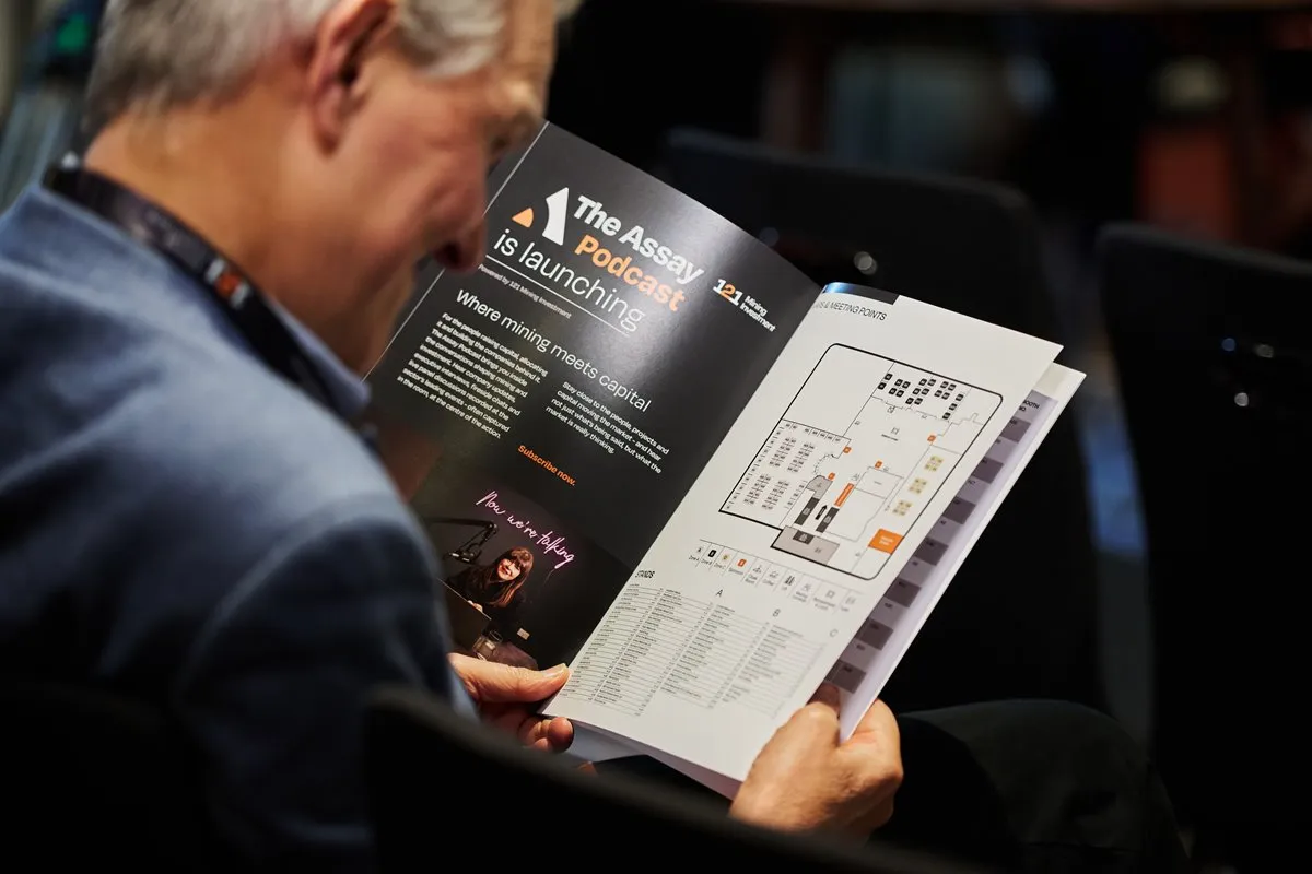 Attendee reviewing the 121 Mining Investment London event directory