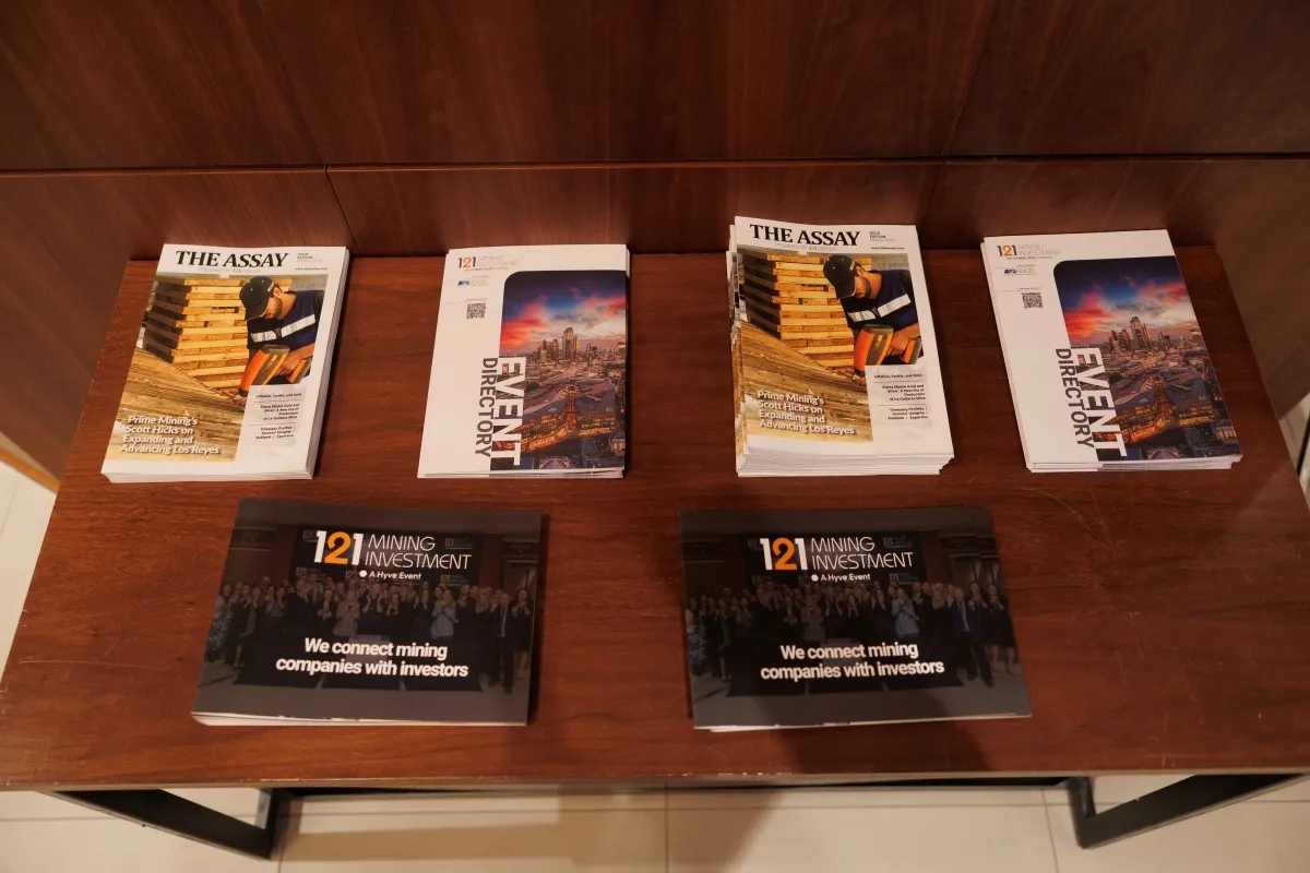 The Assay magazines and 121 Mining Investment event directories displayed for attendees